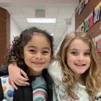 photograph of two kindergarten students in the hallway